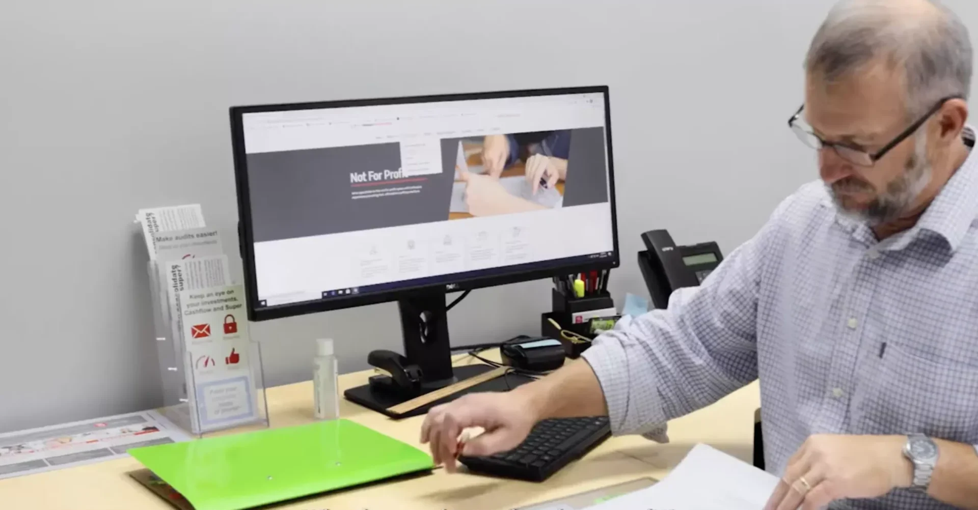 David working at his desk